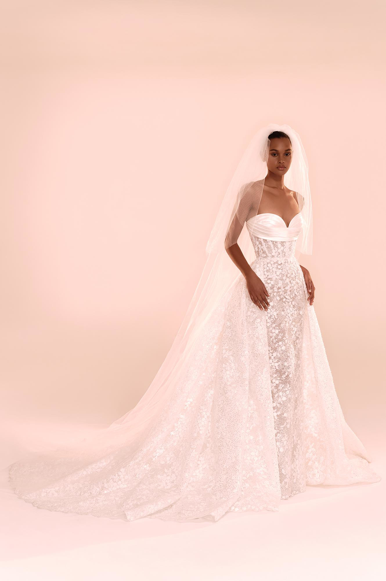 Zuhair Murad Mariage Fall 2026 Look 26 strapless lace wedding dress with satin bodice, detachable overskirt and long veil