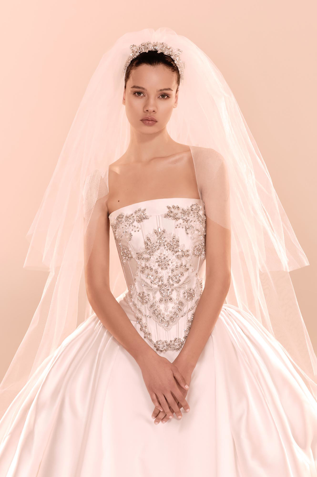 Zuhair Murad Mariage Fall 2026 Look 5 off-shoulder lace wedding dress with corset bodice, long sleeves and full overskirt
