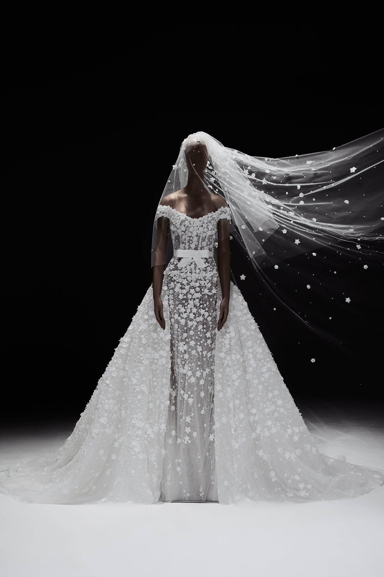 Zuhair Murad Mariage Spring 2027 Look 29 off-shoulder wedding dress with floral appliqués, bow belt and full overskirt