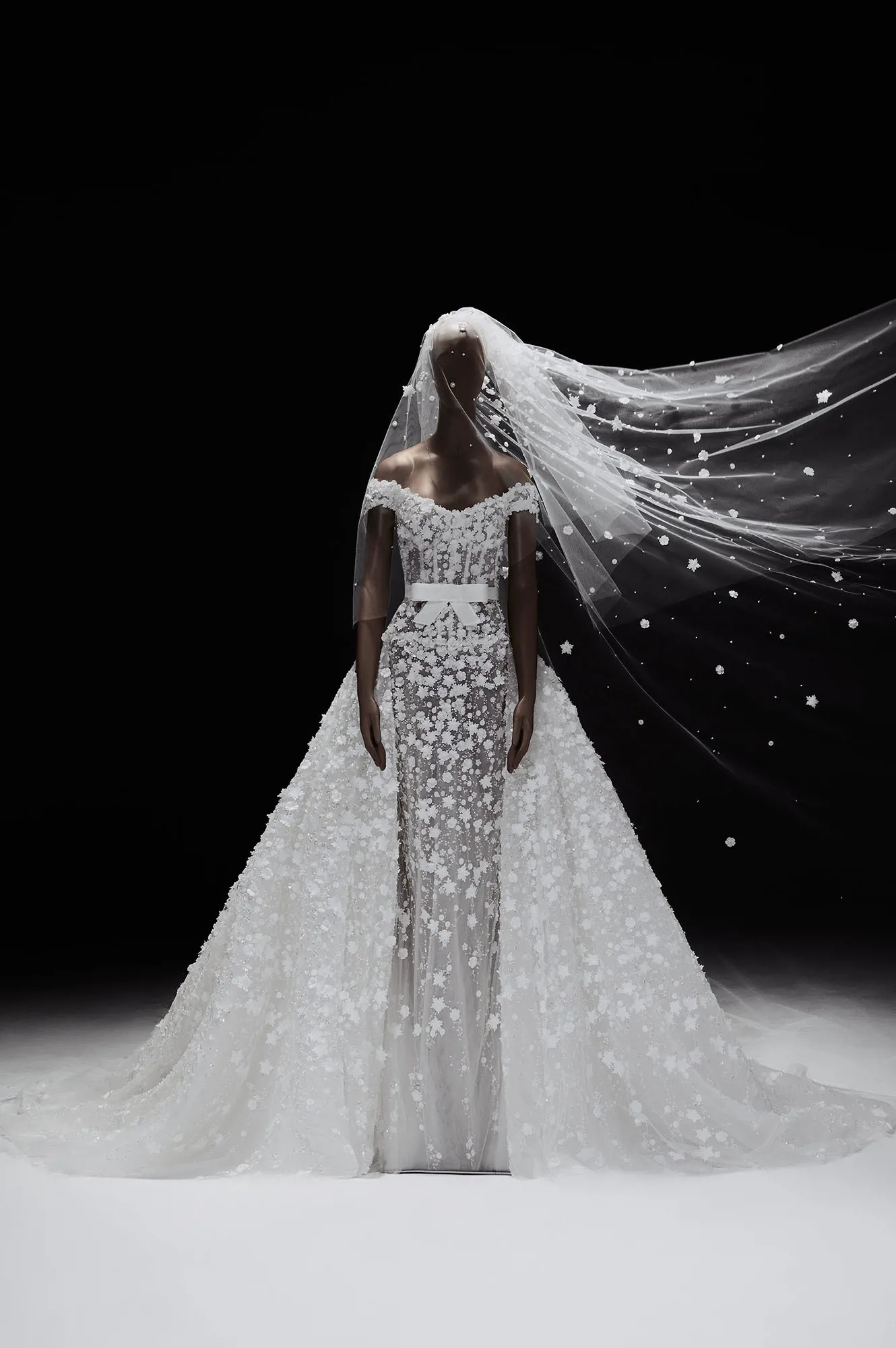 Zuhair Murad Mariage Spring 2027 Look 29 off-shoulder wedding dress with floral appliqués, bow belt and full overskirt